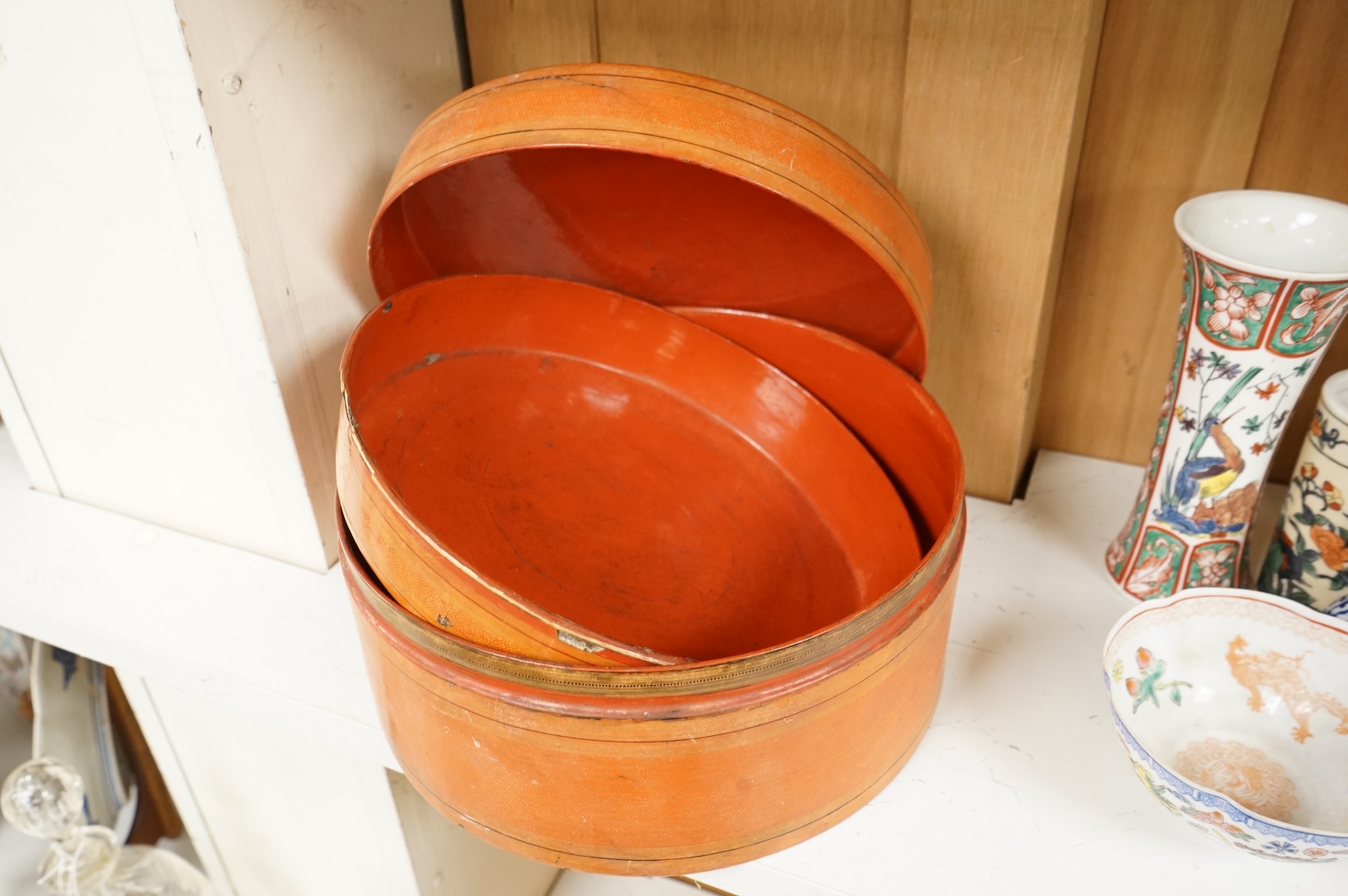 Two 19th century Burmese lacquered cylindrical boxes, largest 27cm in diameter